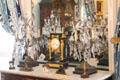 Candlesticks with crystals flank mantel clock in Egyptian-revival style at Chepstow. Newport, RI.