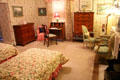 Bedroom with flowered wallpaper at Chepstow. Newport, RI.