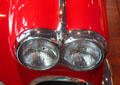 Double headlight of Chevrolet Corvette convertible at Audrain Automobile Museum. Newport, RI.