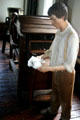 Mannequin reminds Slater Mill visitors that running a cotton carding machine was dangerous child labor. Pawtucket, RI.