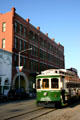 Galveston Island Trolley passes Grand Opera House. Galveston, TX.