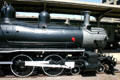 Boiler & drive wheels of Cook Locomotive Works 4-6-0 steam locomotive at Railroad Museum. Galveston, TX.