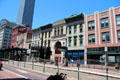 Heritage commercial buildings on Main St. over Preston St. light rail stop. Houston, TX.