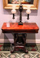 Argand lamp on card table supported by swan-neck lyre base in Chillman Parlor at Bayou Bend. Houston, TX.