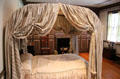 Bedroom with canopied bed in American vernacular Maple bedroom at Bayou Bend. Houston, TX.