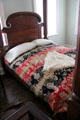 Four-poster bed with coverlet at Kellum-Noble House at Sam Houston Park. Houston, TX.