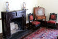 Fireplace with desk & side chairs in Pilot House at Sam Houston Park. Houston, TX.