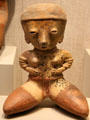 Nayarit culture earthenware seated female figure from West Coast Mexico at San Antonio Museum of Art. San Antonio, TX.