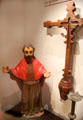 Spanish statue of St. Joseph & carved cross in museum at Mission San José. San Antonio, TX.