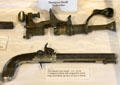 Antique shotgun shell reloader & percussion lock pistol at Pioneer Museum. Fredericksburg, TX.