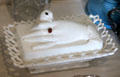 White-glass covered dish with hand & dove at Pioneer Museum. Fredericksburg, TX.