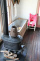 Bathtub & stove in Arhelger Bath House at Pioneer Museum. Fredericksburg, TX.
