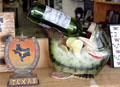 Ceramic fish drinking wine & Texas symbol in shop window. Fredericksburg, TX.