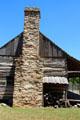 Stone chimney of Sam Ealy Johnson log house. Johnson City, TX.