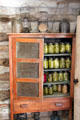 Cabinet with preserves at Sauer-Beckmann Farmstead. Stonewall, TX.