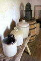 Stoneware jugs & sausage stuffer at Sauer-Beckmann Farmstead. Stonewall, TX.