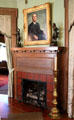 Portrait of W.P.H. McFaddin over fireplace in library at McFaddin-Ward House. Beaumont, TX.
