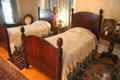 Bedroom with twin beds with acorn posts at McFaddin-Ward House. Beaumont, TX.