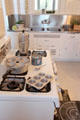 Kitchen with gas range & metal sink at McFaddin-Ward House. Beaumont, TX.