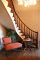 Curved staircase in hall at East Terrace House. Waco, TX.