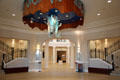 Entrance hall of National Cowgirl Museum with sculpture of jumping horse. Fort Worth, TX.
