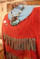 Jingle dress to create musical effect for tribal dancing with antique turquoise necklace at Stockyards Museum. Fort Worth, TX.
