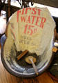 Sitting bathtub with pricing towel "First water 15¢ used water 5¢" at Stockyards Museum. Fort Worth, TX.
