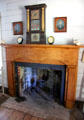 Fireplace with mantle clock in Mr. & Mrs. French's bedroom at John Jay French Museum. Beaumont, TX