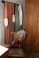 Clothing hung on pegs in Mr. & Mrs. French's bedroom at John Jay French Museum. Beaumont, TX.