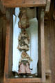 Three antique hand-made dolls - corn cob, walnut head, & pecan head - in crib at John Jay French Museum. Beaumont, TX.