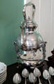 Silver tea pot on heating platform at Neill-Cochran House Museum. Austin, TX.