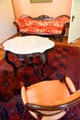 Parlor table & sofa at Neill-Cochran House Museum. Austin, TX.