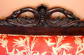 Detail of carved swans neck on Empire-style sofa's back at Neill-Cochran House Museum. Austin, TX.