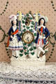 Clock set in ceramic stand depicting couple in red, white & blue costumes at Neill-Cochran House Museum. Austin, TX.