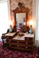 Eastlake dresser with mirror in bedroom at Neill-Cochran House Museum. Austin, TX.