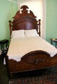 Carved bedstead at Neill-Cochran House Museum. Austin, TX.