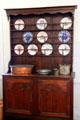 Sideboard with plates at in kitchen French Legation Museum. Austin, TX.