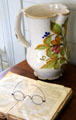 Ceramic pitcher & cookbook in kitchen at French Legation Museum. Austin, TX.