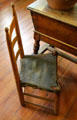 Side chair with cow-hide seat in kitchen at French Legation Museum. Austin, TX.