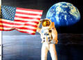 Scene of Astronaut saluting U.S. flag on moon landing at Bullock Texas State History Museum. Austin, TX