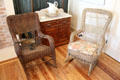 Wicker rocking chairs, pitcher, basin & washstand at Susanna Dickinson Museum House. Austin, TX.