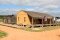 Log barn & board-&-batten dogtrot house at Pioneer Farms. Austin, TX.