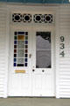 Front door of heritage house with Eastlake features. Columbus, TX.