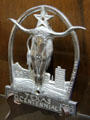 Texas Centennial commemorative metal longhorn in horseshoe at Gonzales Historical Memorial. Gonzales, TX.