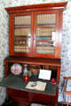 Desk with bookcase in Muenzler House at Pioneer Village. Gonzales, TX.