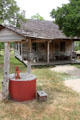 Gates house with water pump at Pioneer Village. Gonzales, TX.