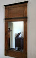Wood framed wall mirror in Baetge House at Conservation Plaza. New Braunfels, TX.
