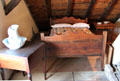 Bed in children's dormitory in attic at Museum of Texas Handmade Furniture. New Braunfels, TX.