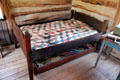 Double pine bed with trundle bed in Reininger Log Cabin at Museum of Texas Handmade Furniture. New Braunfels, TX.