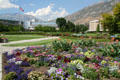 Flowers on central Quad of Brigham Young University with curved Abraham O. Smoot Administration Building. Provo, UT.
